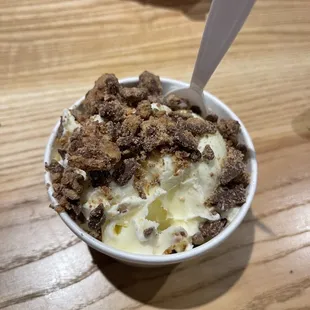 a bowl of ice cream with a spoon in it