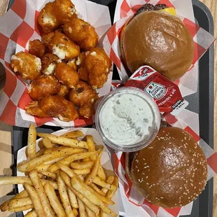 a tray of food including a burger and fries