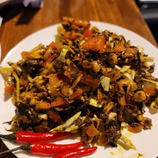 Fermented tea leaf salad w crispy fava beans.