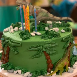 Custom dinosaur cake- $170, 35 servings (messed up during transport) I advise you get DaisyCakes to deliver!