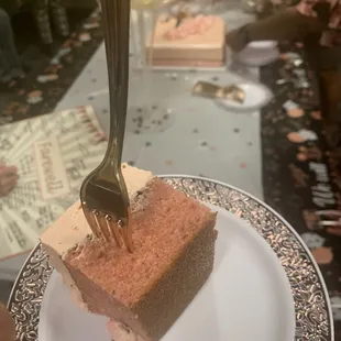 a piece of cake on a plate with a fork