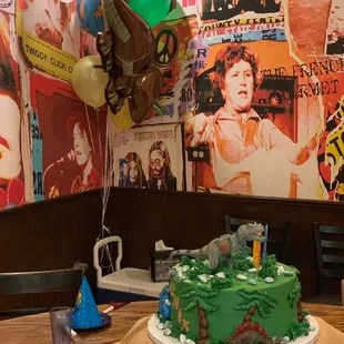 Custom dinosaur cake (35 servings)- $170 (It got a little messed up during transport) I advise you get DaisyCales to deliver!