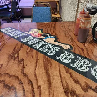 a wooden table with a sign on it