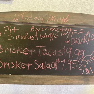 a menu on a chalkboard