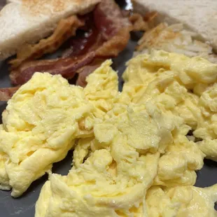 scrambled eggs and toast on a plate
