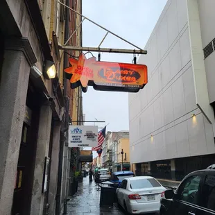 a street with cars parked on the sidewalk