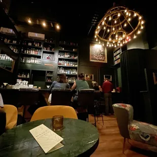 View of the bar/entrance (on the right) from my little table in the corner