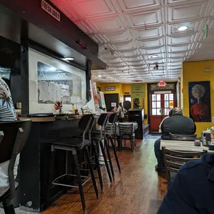 a woman sitting at a bar