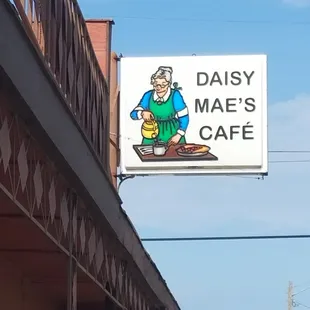 a sign for daisy mae&apos;s cafe