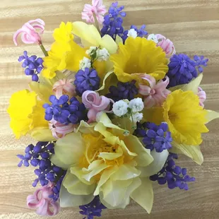 a bouquet of daffodils and other flowers