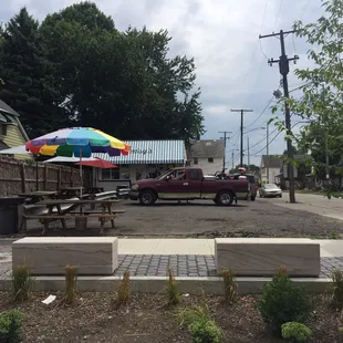 Small parking lot, few picnic tables. You can park on the street or most people park across the street in the vet&apos;s lot.