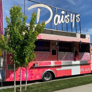 a pink and white food truck