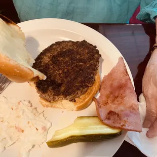 My mother ordered a Cubano sandwich and she got a burger with a slice of ham on a burger bread.