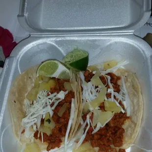 Pastor tacos with cabbage and pineapple. Soooo very good. Juicy and delicious meat.