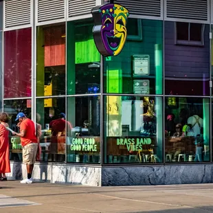 eople standing in front of a restaurant