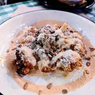 ROASTED CAULIFLOWER - fire sauce, parmesan, sunflower seeds