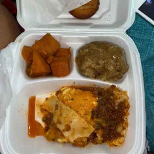 Lasagna, yams, and dressing with gravy.