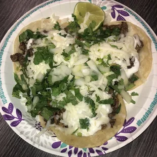 Carne Asada tacos with sour cream and cheese