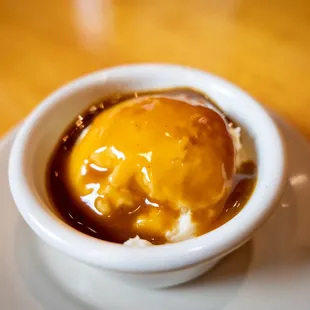 Side of mashed potatoes and brown gravy