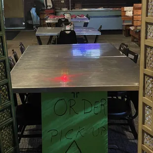 a table with a sign on it