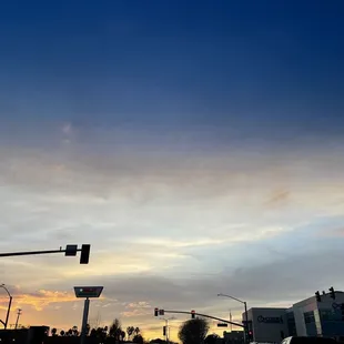 a traffic light at sunset