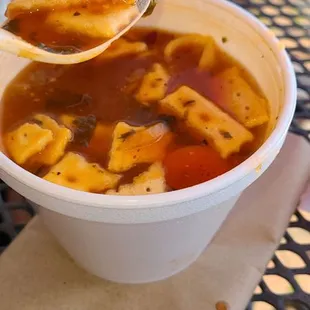 a bowl of soup with a spoon in it