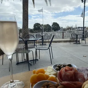 a glass of wine and a plate of food