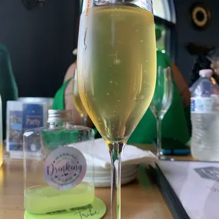 A glass of their peach mimosa