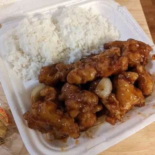 chicken and rice in a styrofoam container