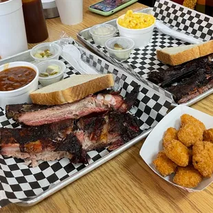 A three rib tray and two rib tray with a side of corn nuggets