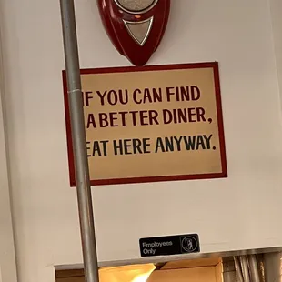a sign on the wall saying if you can find a better diner, eat here anyway