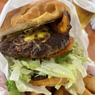 Classic Wahlburger with bacon and cheese onion rings for a side