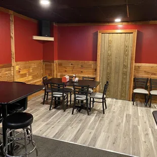 a dining area with tables and chairs
