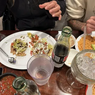 Sopes with everything on it and rice and beans