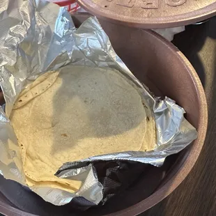 Fresh made hand clapped corn tortillas.