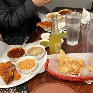 Quesbirria platter with rice and beans