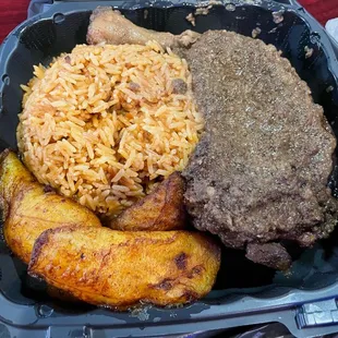 Jerk chicken with tomato rice and plantains