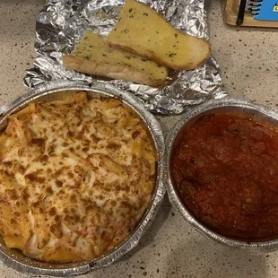 Baked Ziti Dinner with a side of Sausages in Marinara Sauce and Garlic Bread