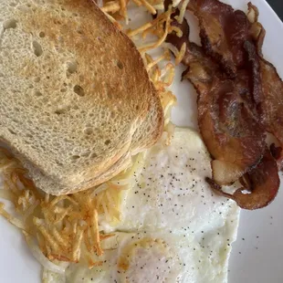 Eggs, hasbrown, sour dough toast and bacon