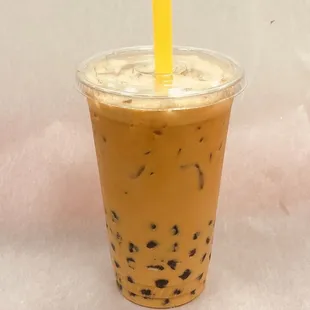 a plastic cup with a straw