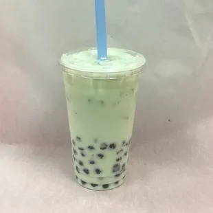 a plastic cup with a blue straw