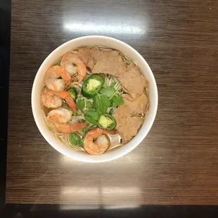 a bowl of noodles and shrimp