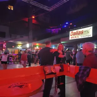 a group of people at a bar
