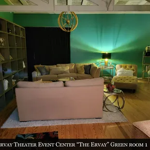 a living room with green walls