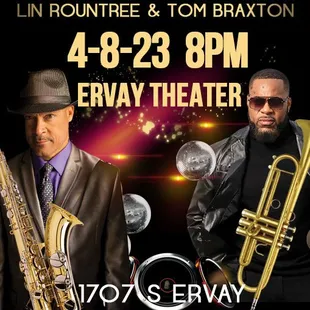 two men in suits and hats with instruments