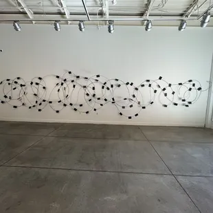 Art by Diana - barbed wire fence with passports with the names of the fallen