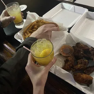L-R Cheeseburger &amp; Hot Wings alongside Screwdriver &amp; Amaretto Stone Sour