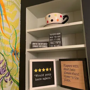 a shelf with coffee mugs