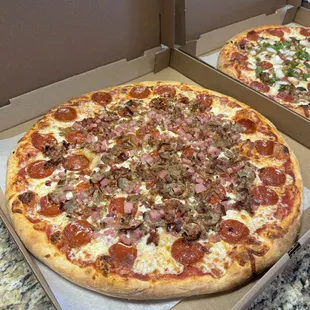 Meat Supreme Pizza  
(Pepperoni, Sausage, Bacon, Ham &amp; Meatballs).