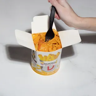 a hand holding a fork